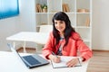 Portrait of beautiful business woman working at her desk with laptop. Royalty Free Stock Photo