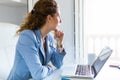 Beautiful businesswoman working with her laptop in the office. Royalty Free Stock Photo