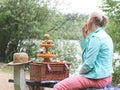 Portrait of a beautiful middle-aged caucasian blonde woman eating a big red and ripe strawberry Royalty Free Stock Photo