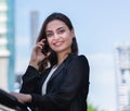 portrait of beautiful caucasian woman in black suit calling and looking at camera. Royalty Free Stock Photo