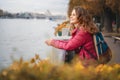 Portrait Beautiful charming young funny happy girl with red curly hair and on the promenade in the autumn park Royalty Free Stock Photo