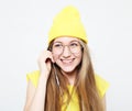 Portrait of beautiful cheerful girl with headphones with long hair smiling laughing looking at camera