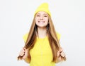 Portrait of beautiful cheerful girl with headphones with long hair smiling laughing looking at camera