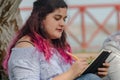 Portrait of a beautiful chubby woman writing notes in her notebook Royalty Free Stock Photo