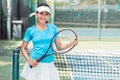 Portrait of a beautiful and competitive Asian tennis player