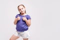 Portrait of a beautiful and confident girl showing thumbs up on white background Royalty Free Stock Photo