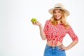 Portrait of beautiful country girl with apple over white background. Royalty Free Stock Photo