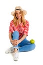 Portrait of beautiful country girl with apple over white background. Royalty Free Stock Photo