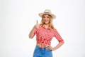 Portrait of beautiful country girl showing okay over white background. Royalty Free Stock Photo