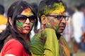 Portrait of beautiful couple at Holi, the color festival of India.