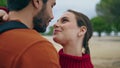 Portrait beautiful couple nature. Happy man kissing smiling woman nose outdoors. Royalty Free Stock Photo