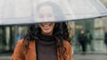 Portrait of beautiful cute flirting brunette woman with curly hair attractive girl tourist with transparent umbrella Royalty Free Stock Photo