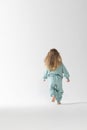 Portrait of beautiful cute little toddler girl. Child with funny face. Pretty smile kid in studio on white background