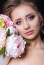 Portrait of beautiful cute sweet girl with beautiful bride with bright makeup evening wedding hairstyle with bouquet Royalty Free Stock Photo