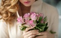 Portrait of a beautiful delicate sensual blonde girl with roses, focus on the rose Royalty Free Stock Photo