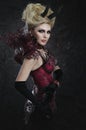 Portrait of beautiful devil woman in dark dress Royalty Free Stock Photo