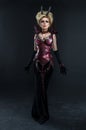 Portrait of beautiful devil woman in dark dress Royalty Free Stock Photo