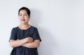 Portrait of beautiful elderly asian woman standing cross arms and looking camera indoor,Happy and smile face,Copy space for text o Royalty Free Stock Photo