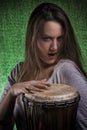 Expressive Wild Woman Playing Djembe Drum