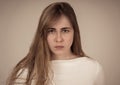 Portrait of a beautiful emotional young woman looking furious and angry. Human expressions Royalty Free Stock Photo