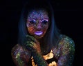 Portrait of Beautiful Fashion Woman in Neon UF Light. Model Girl with Fluorescent Creative Psychedelic MakeUp, Art Royalty Free Stock Photo