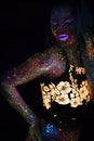 Portrait of Beautiful Fashion Woman in Neon UF Light. Model Girl with Fluorescent Creative Psychedelic MakeUp, Art Royalty Free Stock Photo
