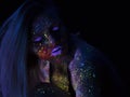 Portrait of Beautiful Fashion Woman in Neon UF Light. Model Girl with Fluorescent Creative Psychedelic MakeUp, Art Royalty Free Stock Photo