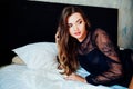 Portrait of beautiful fashionable European women in underwear in the bedroom on the bed sleep Royalty Free Stock Photo