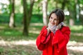 Portrait of a beautiful fashionable girl outdoor on sunny spring day, breating fresh air in park.