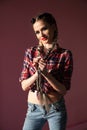 Portrait of a beautiful fashionable woman with braids in a country shirt Royalty Free Stock Photo