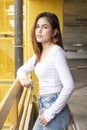 Portrait of Beautiful fashionista woman in white shirt and blue jeans