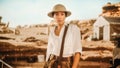 Portrait of Beautiful Female Adventurer Posing and Looking at Camera. Stylish Great Archaeologist