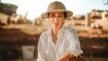 Portrait of Beautiful Female Adventurer Posing and Looking at Camera. Stylish Great Archaeologist