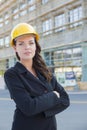 Portrait of Beautiful Female Contractor Wearing Hard Hat at Construction S