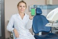 Female Dentist Presenting Mobile App