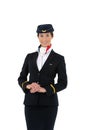 Portrait of a beautiful female flight attendant smiling isolated on white background Royalty Free Stock Photo