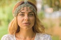 Portrait of a beautiful female wearing boho chic headpiece