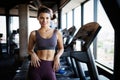 Portrait of a beautiful fit sporty woman in gym Royalty Free Stock Photo