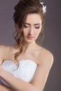 Portrait of a beautiful gentle and elegant girl women bride in a white dress with a beautiful hairstyle and makeup Royalty Free Stock Photo