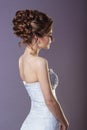 Portrait of a beautiful gentle and elegant girl women bride in a white dress with a beautiful hairstyle and makeup Royalty Free Stock Photo