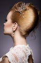 Portrait of a beautiful ginger woman in the image of the bride. Hairstyle back view Royalty Free Stock Photo