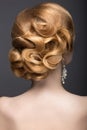 Portrait of a beautiful ginger woman in the image of the bride. Hairstyle back view Royalty Free Stock Photo