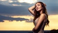 Portrait of a beautiful girl against the background of a cloudy evening sky at sunset, a young woman in a summer dress resting on