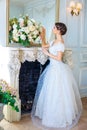 Portrait of a beautiful girl in a ball gown in the interior. Concept of tenderness and pure beauty in sweet princess look. Beautif Royalty Free Stock Photo