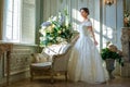 Portrait of a beautiful girl in a ball gown in the interior. Concept of tenderness and pure beauty in sweet princess look. Beautif Royalty Free Stock Photo