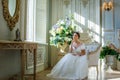 Portrait of a beautiful girl in a ball gown in the interior. Concept of tenderness and pure beauty in sweet princess look. Beautif Royalty Free Stock Photo