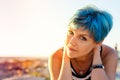 A portrait of beautiful girl with blue hair in sailor's striped