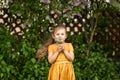 Portrait of a beautiful girl with a bouquet of forget-me-nots