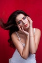 Portrait of beautiful girl with colorful eyemakeup in white shirt