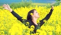 Portrait of a beautiful girl in the colza field in summer Royalty Free Stock Photo